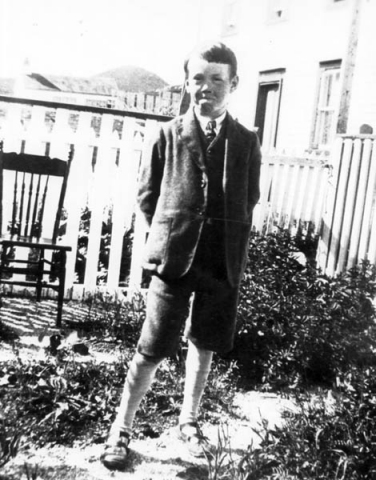 167: Vince McCarthy in the family flower garden. Denis McCarthy's house is in  the background. (circa 1928)  - son of James McCarthy &amp;amp; Julia Reddy